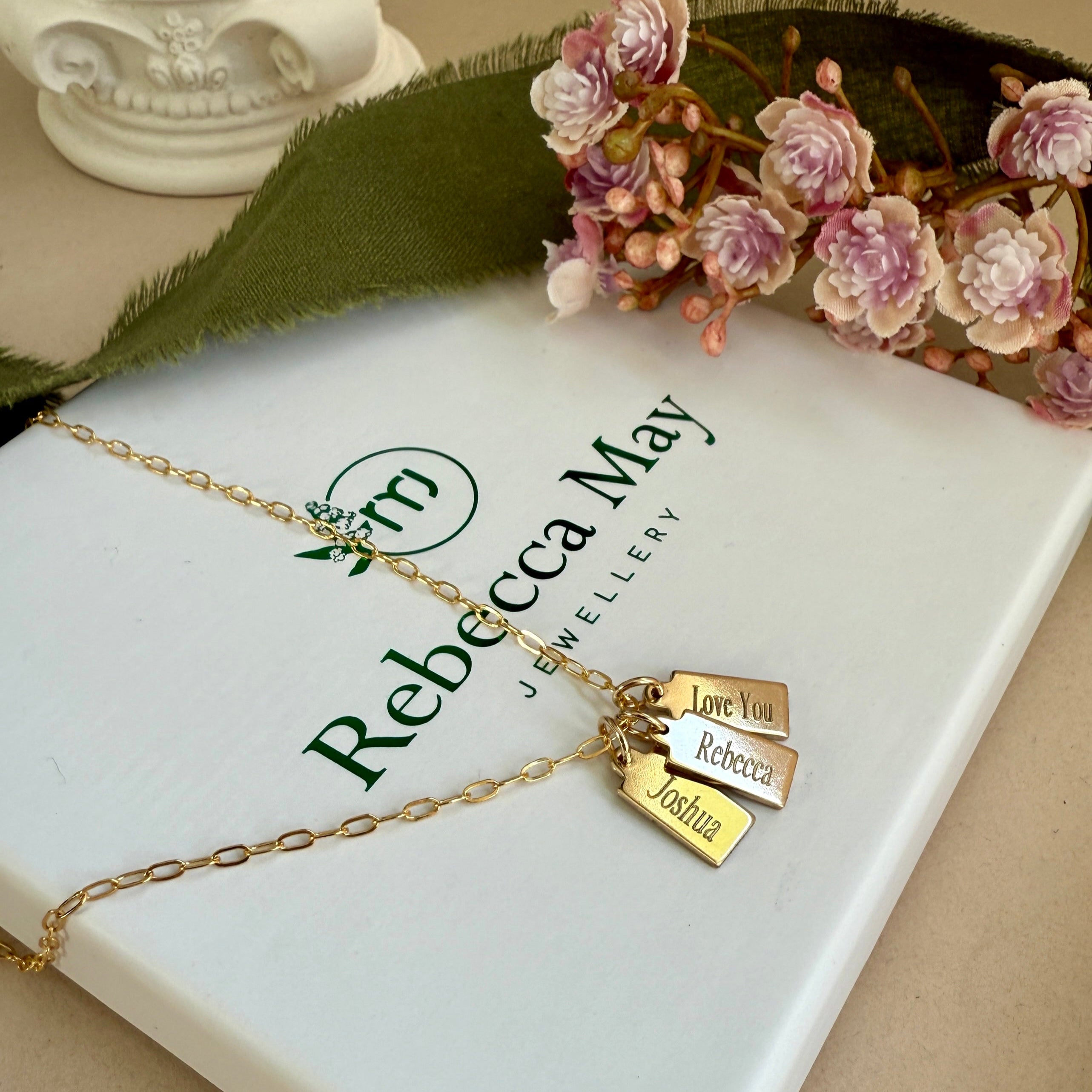 Gold filled necklace with engraved name tags.