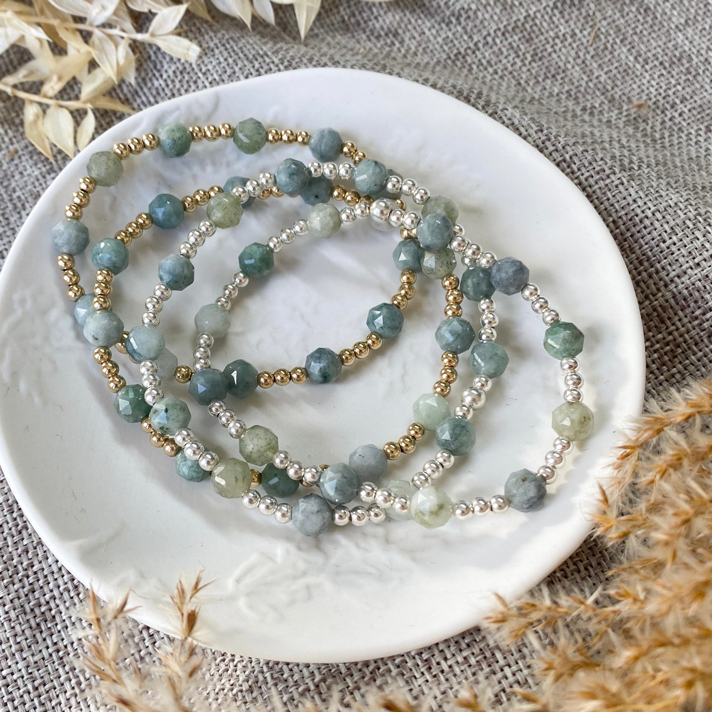 Gold filled and sterling silver stacking bracelets. Green gemstone bracelets.