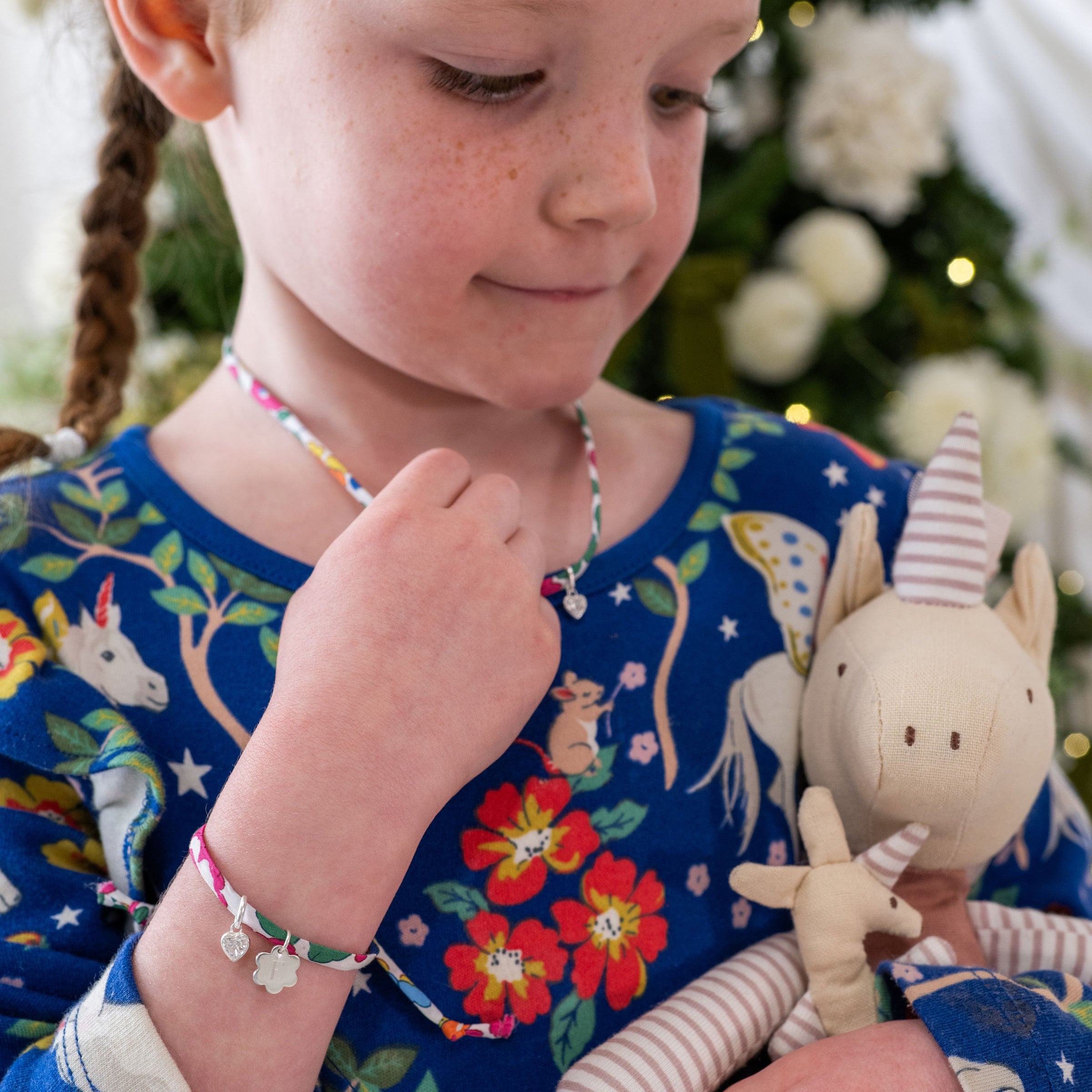 Girl wearing birthstone liberty necklace and bracelet set
