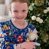 Young girl wearing her Liberty birthstone necklace and liberty bracelet