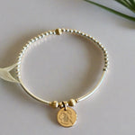 Beaded bracelet made with sterling silver and gold filled with a birth month flower 